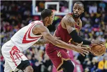  ?? David Dermer / Associated Press ?? Rockets forward Trevor Ariza, left, will be one of several players called on to defend the Cavs’ LeBron James, right.