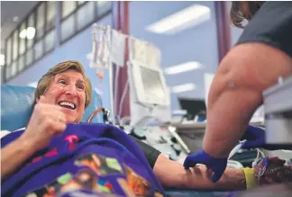  ?? Photos by Hyoung Chang, The Denver Post ?? Chris Orr, 64, donates her 70th gallon of blood at a Vitalent donation center in Denver on Wednesday, the first woman in Colorado to hit that number.