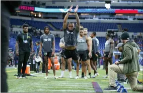  ?? AP PHOTO/DARRON CUMMINGS ?? Michigan defensive back DJ Turner II runs a drill at the NFL football scouting combine in Indianapol­is, Friday, March 3, 2023.