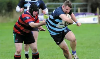  ??  ?? Tim Lynch Killorglin caught by Liam Lynch Bantry RFC in Killorglin RFC grounds at Beaufort on Sunday.