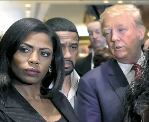  ?? Timothy A. Clary/AFP/Getty Images ?? Omarosa Manigault Newman appears with President Donald Trump during a news conference after Mr. Trump’s meeting with African-American religious leaders in 2015 in New York. Mr. Trump last week lashed out at Ms. Manigault Newman, his former aide, in especially angry terms, slamming her as a “dog” and “crazed.”