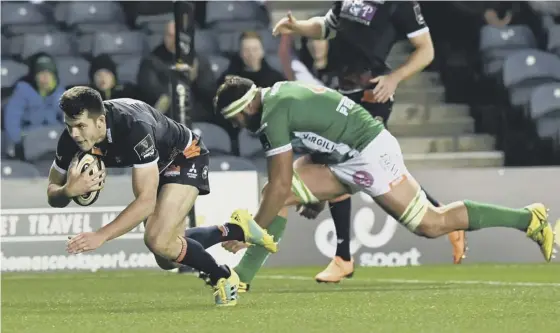  ??  ?? Blair Kinghorn crosses for Edinburgh’s third try against Benetton at Murrayfiel­d last night.