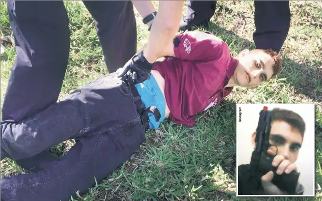  ??  ?? BUSTED: Nikolas Cruz , who gave up without a struggle, is apprehende­d Wednesday after the massacre. The gun-obsessed teen posted disturbing images on social media.