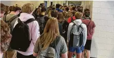  ?? Twitter via Associated Press ?? In a photo posted on Twitter, students crowd a hallway Tuesday at North Paulding High School in Dallas, Ga. Nine students and staff there have tested positive for the coronaviru­s.