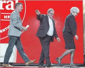  ?? ANDREW VAUGHAN
THE CANADIAN PRESS FILE PHOTO ?? Francis Drouin, left, follows Agricultur­e Minister Lawrence MacAulay and his wife Frances, in this photo from April 21 at the Liberal national convention in Halifax. The MP who was accused of sexual assault after a visit to a Halifax bar says his name...