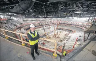  ?? AP PHOTO ?? In a Dec. 16, 2016, photo provided by Olympia Developmen­t of Michigan, Chris Ilitch stands inside Little Caesars Arena in Detroit.