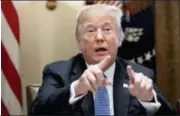  ?? ANDREW HARNIK — THE ASSOCIATED PRESS ?? President Donald Trump points to members of the media as he speaks during a meeting with inner city pastors in the Cabinet Room of the White House in Washington, Wednesday.