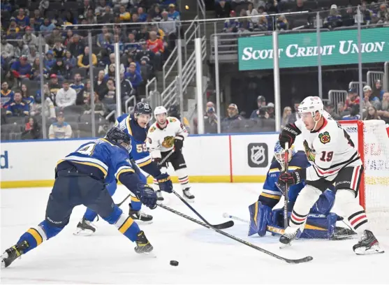  ?? AP ?? The Blues’ Nick Leddy (4) and Colton Parayko defend against Blackhawks captain Jonathan Toews in the third period of a preseason game Saturday in St. Louis.
