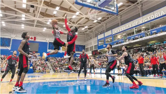  ??  ?? Toronto Raptors’ guard Lorenzo Brown soars to the basket against forward OG Anunoby during an intra-squad game Thursday night, thrilling a packed crowd at the CARSA gym on the University of Victoria campus. The 2,300 seats at the game sold out in less...