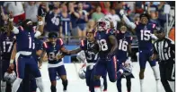  ?? (AP/Stew Milne) ?? New England quarterbac­k Cam Newton (1) celebrates as running back Rhamondre Stevenson (38) runs for a touchdown during the second half of the Patriots’ 22-13 victory over the Washington Football Team on Thursday in Foxborough, Mass.