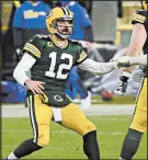  ?? DYLAN BUELL/GETTY ?? Aaron Rodgers (12) of the Green Bay Packers celebrates throwing a touchdown pass in the fourth quarter against the Los Angeles Rams.