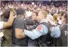  ?? | SCOTT OLSON/ GETTY IMAGES ?? In a controvers­ial video, one activist told an unidentifi­ed interviewe­r using a hidden camera she had a hand in organizing demonstrat­ions at a Trump rally at UIC in March ( above).