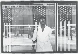  ?? Ming Smith ?? “AMERICA SEEN Through Stars and Stripes, New York City, New York,” circa 1976, by Ming Smith, the Kamoinge Workshop’s sole female photograph­er.