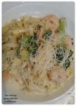  ??  ?? The shrimp pasta alfredo is delicious.