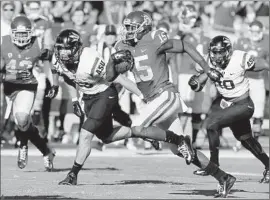  ?? Luis Sinco Los Angeles Times ?? NELSON AGHOLOR RETURNS A PUNT 53 yards against Arizona State in the f irst quarter for the f irst touchdown of the game at the Coliseum.