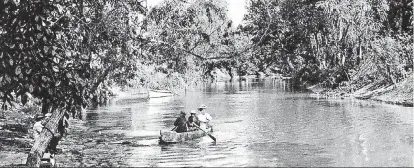  ?? [THE OKLAHOMAN ARCHIVES] ?? BELOW: The Oklahoma River, known as the North Canadian River and shown in this photo during the earliest days of the city, was an oasis of trees along a meandering prairie river during the first 20 years after the 1889 Land Run. This photo was taken along Wheeler Park.