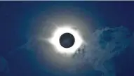  ?? OLEG ROMANOV / ASSOCIATED PRESS ?? A total solar eclipse is observed in 2008 above the mountainou­s Siberian Altai region, about 1,850 miles east of Moscow.