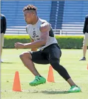  ?? Gerry Melendez Associated Press ?? RECEIVER PHAROH COOPER goes through a drill in front of NFL coaches and scouts in March.