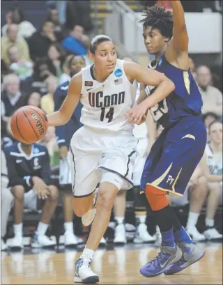  ?? JESSICA HILL/AP PHOTO ?? Uconn point guard Bria Hartley (14) drives past Prairie View’s Latia Williams during the topseeded Huskies’ 83-47 victory in the opening round of the NCAA tournament in Bridgeport.