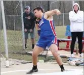  ?? ?? Connor Brown sets to get off throw in shot put which he won with a throw of 49’ 10”. Brown doubled up later in the meet winning the Discus.