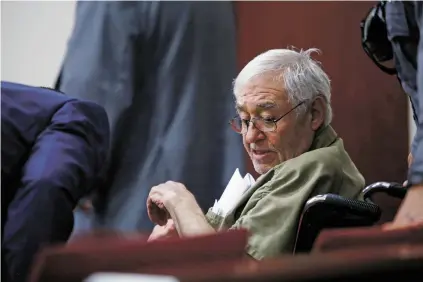  ??  ?? Marvin Archuleta, a former priest accused of raping a 6-year-old boy, sits in Judge Matthew Wilson’s courtroom in District Court on Friday. Wilson ordered Archuleta to be put on house arrest with an ankle monitor.