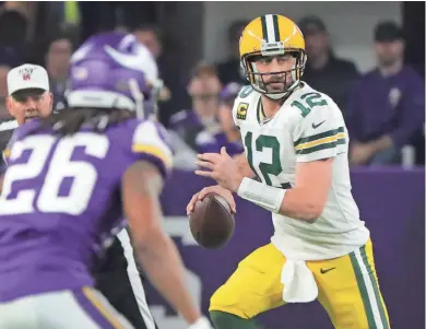  ?? MARK HOFFMAN / JOURNAL SENTINEL ?? Aaron Rodgers wore a wristband last season to help the pace of the offense.