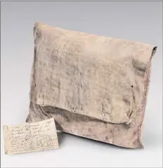  ?? Courtesy Fort Ticonderog­a ?? This knapsack and accompanyi­ng note was carried by a Connecticu­t soldier during the American Revolution.