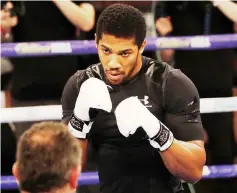  ??  ?? Joshua trains during a pre-fight public work out press conference at York Hall, east London. AFP — photo