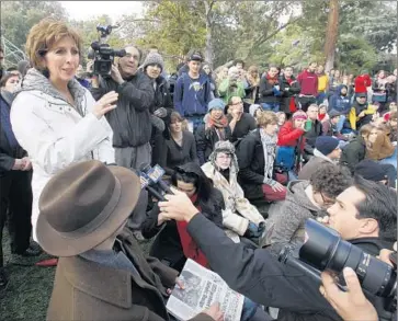  ?? Rich Pedroncell­i Associated Press ?? CHANCELLOR Linda Katehi, left, meets with protesters in 2011, days after students were pepper-sprayed by campus police. Katehi later hired social media firms to combat negative publicity from the incident.