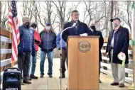  ?? GLENN GRIFFITH - MEDIANEWS GROUP ?? Clifton Park Supervisor Philip Barrett, at podium, makes a few remarks at last week’s official opening of the Clute’s Dry Dock Pedestrian Bridge.