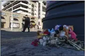  ?? KIRILL ZARUBIN — THE ASSOCIATED PRESS ?? Flowers and toys lie on the ground at a makeshift memorial in Belgorod, Russia, Monday for victims of a Dec. 30missile attack by Ukraine.
