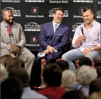  ?? Arkansas Democrat- Gazette/ RICK McFARLAND ?? Former Arkansas Razorbacks Felix Jones ( left) and Peyton Hillis ( right) joke with Little Rock Touchdown Club founder David Bazzel during the organizati­on’s weekly luncheon Monday.