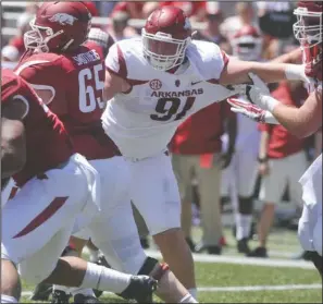  ??  ?? RAVES FOR ROOKIE: Razoraback freshman defensive lineman Hjalte Froholdt, pictured during the spring Red- White game, has impressed Arkansas coaches in preseason practice. Born in Denmark, Froholdt played football at an Ohio high school and a Florida...