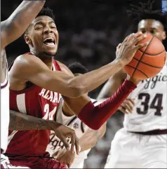  ?? SAM CRAFT/ASSOCIATED PRESS ?? Alabama forward Brandon Miller tries to drive the lane against Texas A&M during Saturday’s game in College Station, Texas. Miller, who was linked to a shooting death earlier this season, is averaging 19.6 points and 8.0 rebounds for the fourth-ranked Crimson Tide.