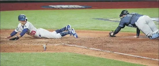  ?? Robert Gauthier Los Angeles Times ?? MOOKIE BETTS, sliding home in Game 1 of the World Series, was taught to think deeply by his father, Willie, whose lessons helped Mookie break out in the majors.