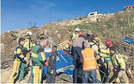  ?? Photo: CANTERBURY WESTPAC RESCUE HELICOPTER ?? Emergency services work to free rally driver Les Summerfiel­d after his Ford Escort rolled 50 metres down a bank during the Rally of Canterbury in Ashley Forest on Sunday.