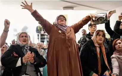 ?? AFP ?? Victims’ relatives celebrate as they watch a live TV broadcast from the Internatio­nal Criminal Tribunal for the former Yugoslavia in Srebrenica, when UN judges announced the life sentence in the trial of ex- Bosnian Serbian commander Ratko Mladic, on...
