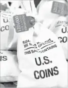  ??  ?? UNSEARCHED: Pictured above are the unsearched Vault Bags loaded with nearly 3 pounds of U.S. Gov’t issued coins some dating back to the 1800’s being handed over to Connecticu­t residents by Federated Mint.