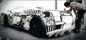  ??  ?? WORK OF ART: Preparing the Lamborghin­i for Top Gear was a four-hour job.