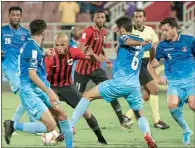  ??  ?? Al Rayyan’s Yacine Brahimi dribbles past Al Shahania’s Mustafa Jalal during their match at the Al Duhail Stadium on Thursday.