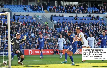  ?? SIMON GALLOWAY ?? Hannes Wolf scores to make it 3-0 to the Swans in the derby win over Cardiff last weekend.