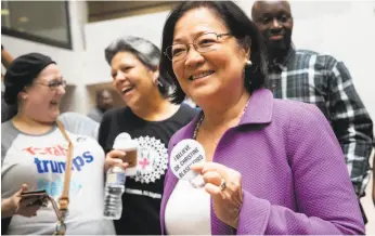  ?? J. Scott Applewhite / Associated Press ?? Senate Judiciary Committee member Mazie Hirono, D-Hawaii, is welcomed Thursday by protesters opposed to Supreme Court nominee Brett Kavanaugh.