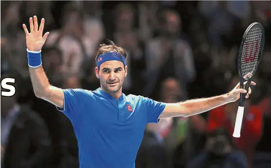  ?? London on Thursday. — AP ?? Certainly not feeling blue: Roger Federer celebrates after beating Kevin Anderson to reach the semi-final of the AFP Finals at the O2 Arena in