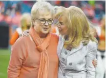  ?? John Leyba, The Denver Post ?? Annabel Bowlen, right, embraces Nan Miller, widow of former Broncos coach Red Miller, during the Ring of Fame ceremony for Red Miller on Sunday.