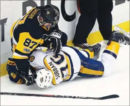  ?? AP PHOTO ?? Pittsburgh Penguins’ Sidney Crosby tangles with Nashville Predators’ P.K. Subban during the first period of Game 5 on Thursday.