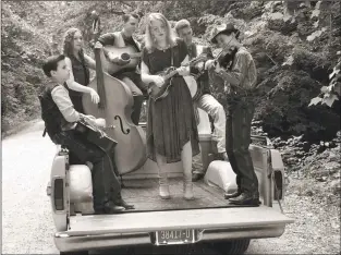  ?? Courtesy photo ?? The Family Sowell isn’t “your typical, boring family band. They are alive, on fire, and grinning with terrific enthusiasm as they tackle difficult music, including “The Devil Went Down to Georgia,” said one reviewer. The family band will play at the Red River Bluegrass Festival.