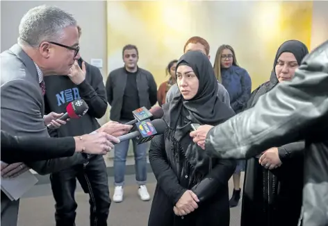  ?? JULIE JOCSAK/STANDARD STAFF ?? Amal Alzurufi, Yosif's mother, speaks to the media following a vigil at Brock University. Staff, students, friends and family of Yosif Al-Hasnawi, gather at the Pond Inlet at Brock University for a vigil Friday.