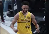  ?? BRYNN ANDERSON — THE ASSOCIATED PRESS ?? Warriors guard Stephen Curry celebrates after winning the 3-point contest at the NBA All-Star Game in Atlanta Sunday.