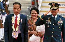  ?? —EV ESPIRITU ?? Indonesian President Joko Widodo and his wife, Lady Iriana