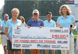  ??  ?? Stacy Lewis, with husband Gerrod Chadwell (left), donated her winnings from the Cambia Portland Classic to Hurricane Harvey relief.